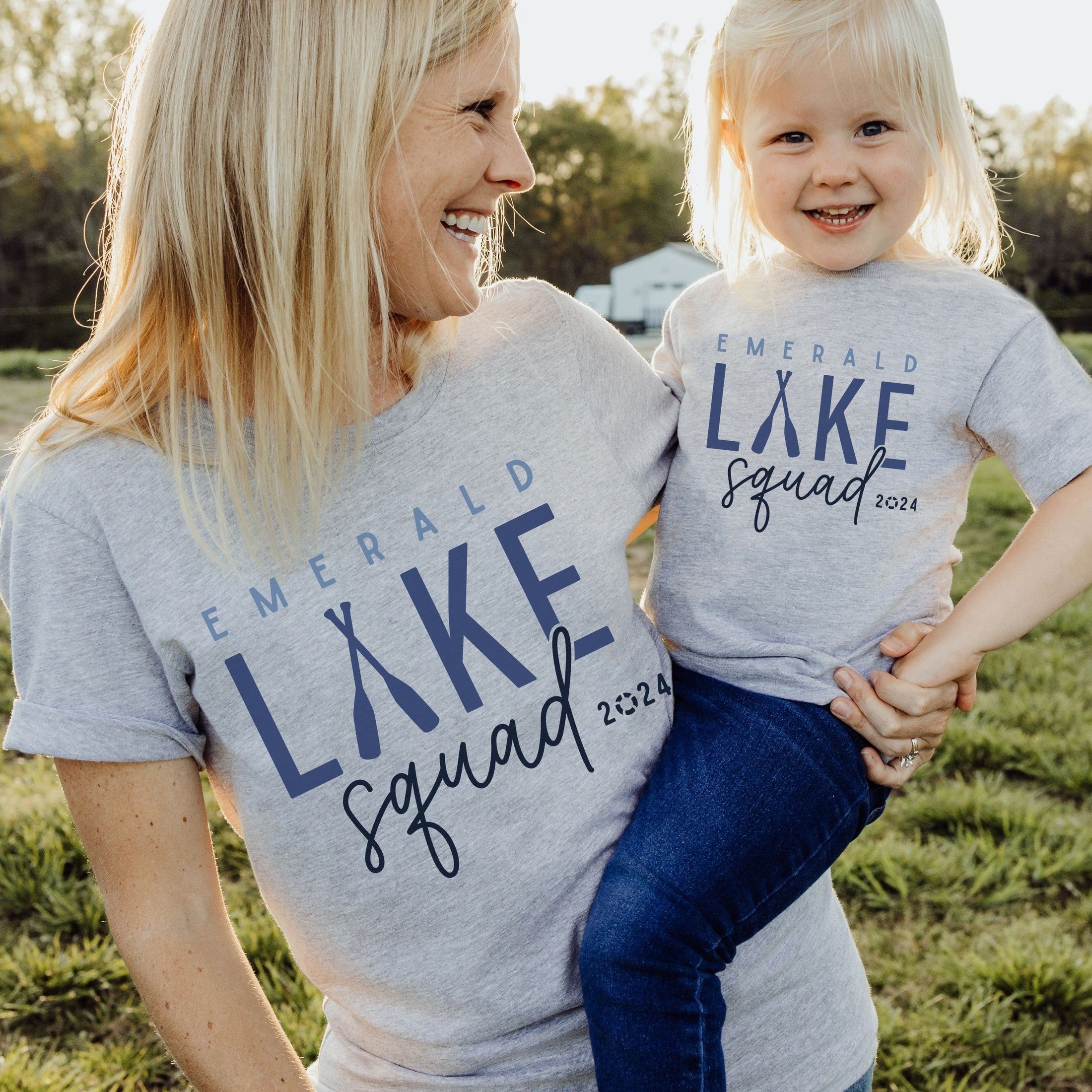 Mom and child wearing custom matching family Lake Squad shirts personalized with name and year. Perfect for group lake vacations, shown in gray tshirt