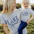 Mom and child wearing custom matching family Lake Squad shirts personalized with name and year. Perfect for group lake vacations, shown in gray tshirt