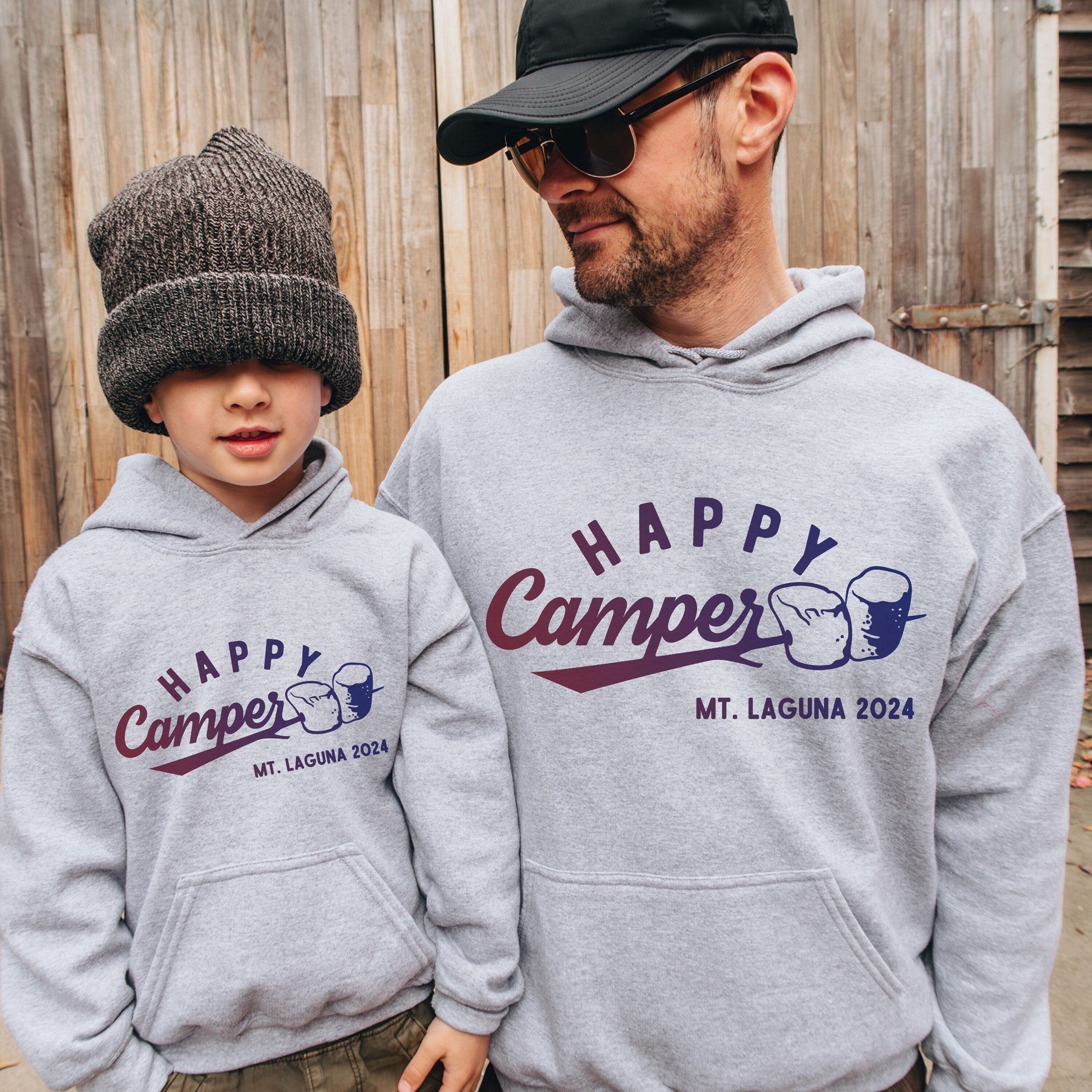 Man and kid wearing custom matching family adventure vacation shirts with s&