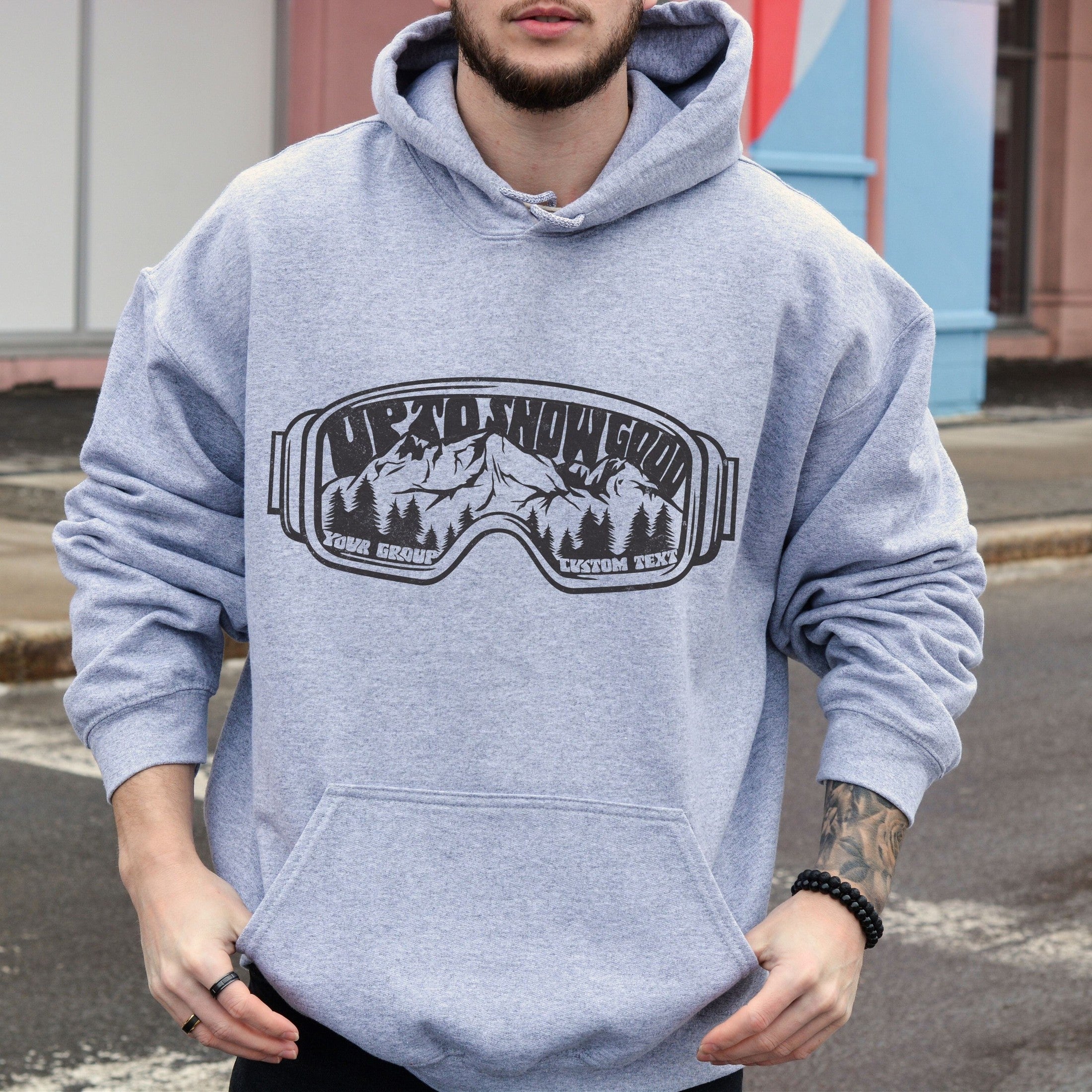 man wearing Custom matching family ski trip hoodie with funny Up To Snow Good goggles design for group mountain weekend vacations shown in gray