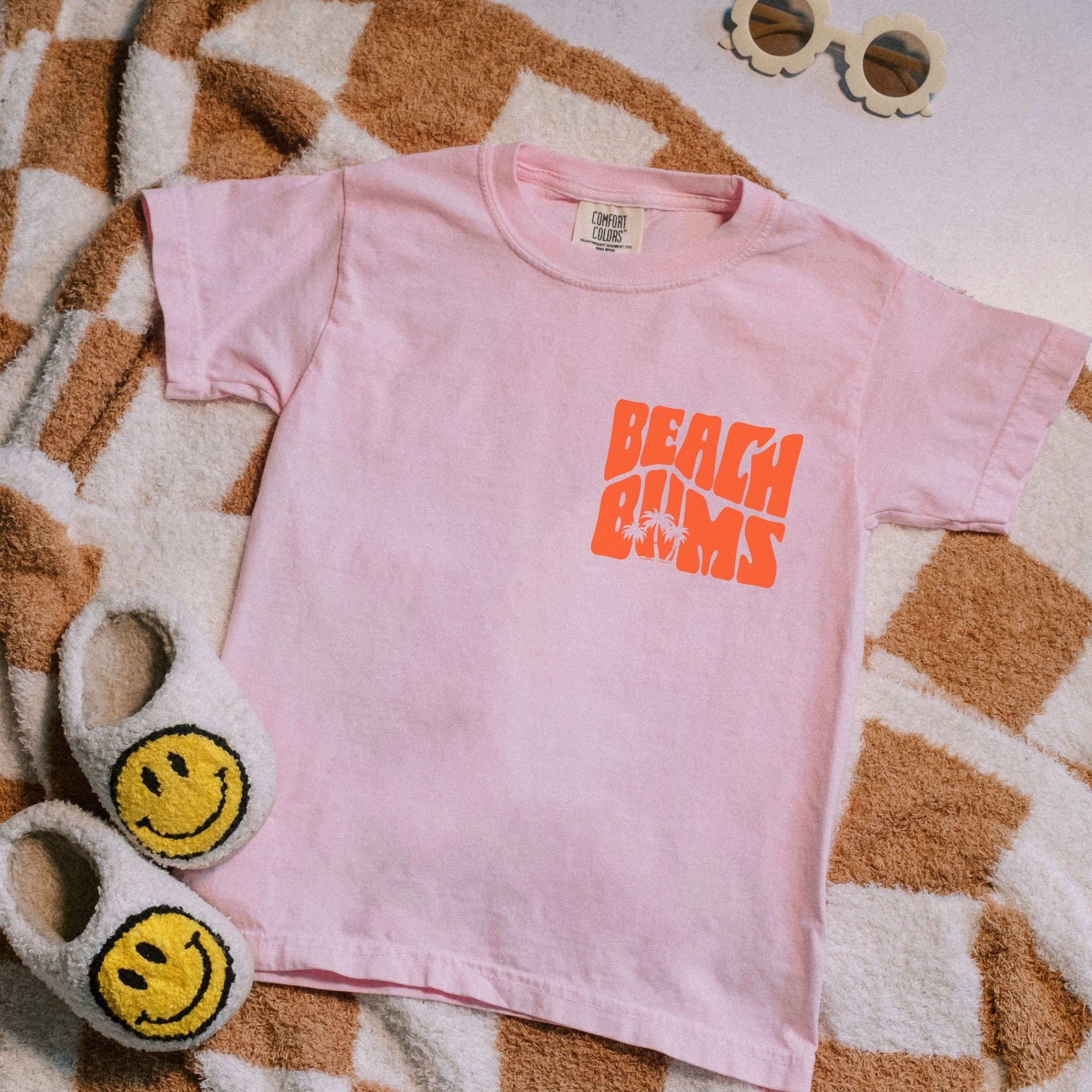 Kids size matching family vacation shirt with retro beach bums design in comfort colors blossom