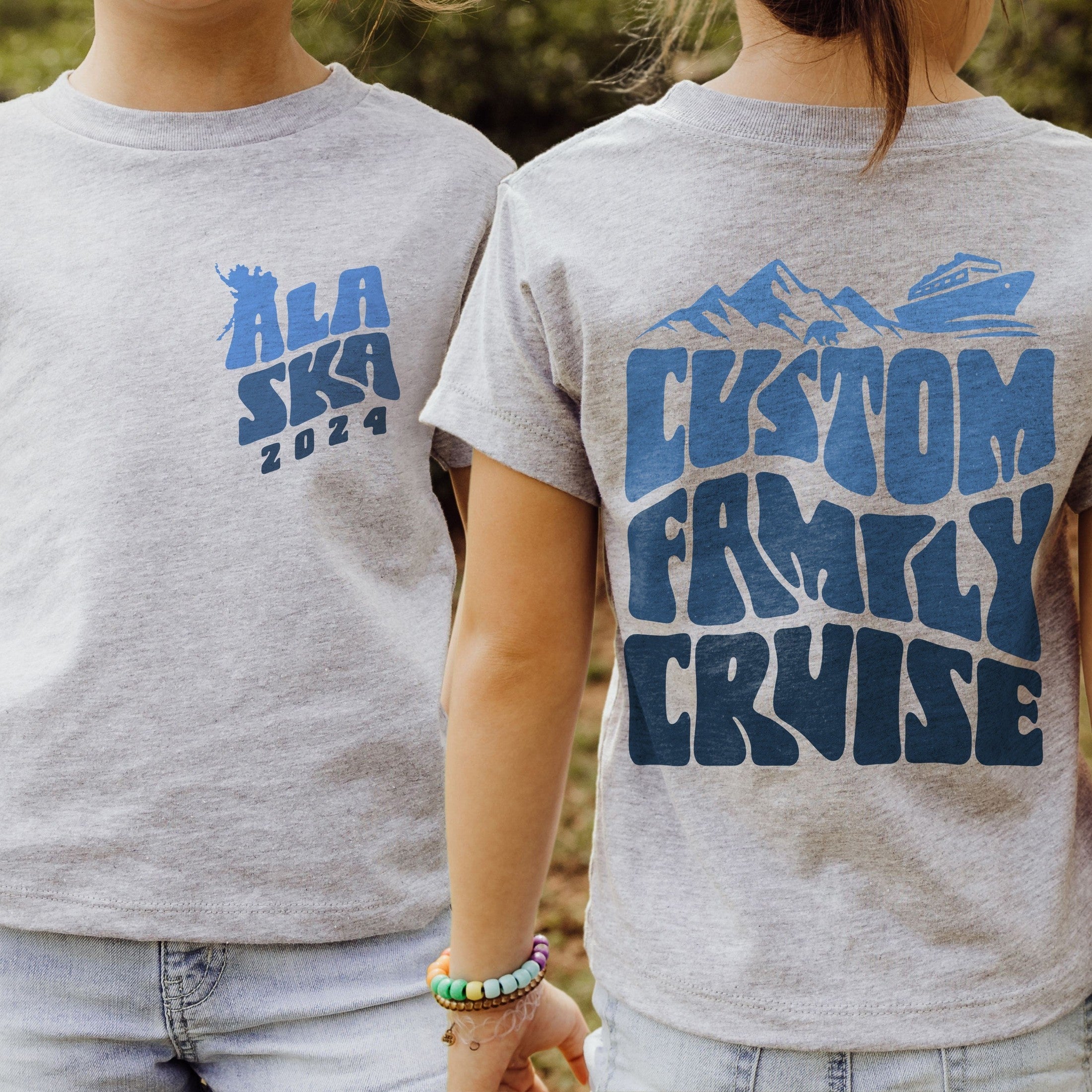 Girl wearing custom matching family Alaska cruise shirt for group Alaskan vacation. Shown in gray tshirt