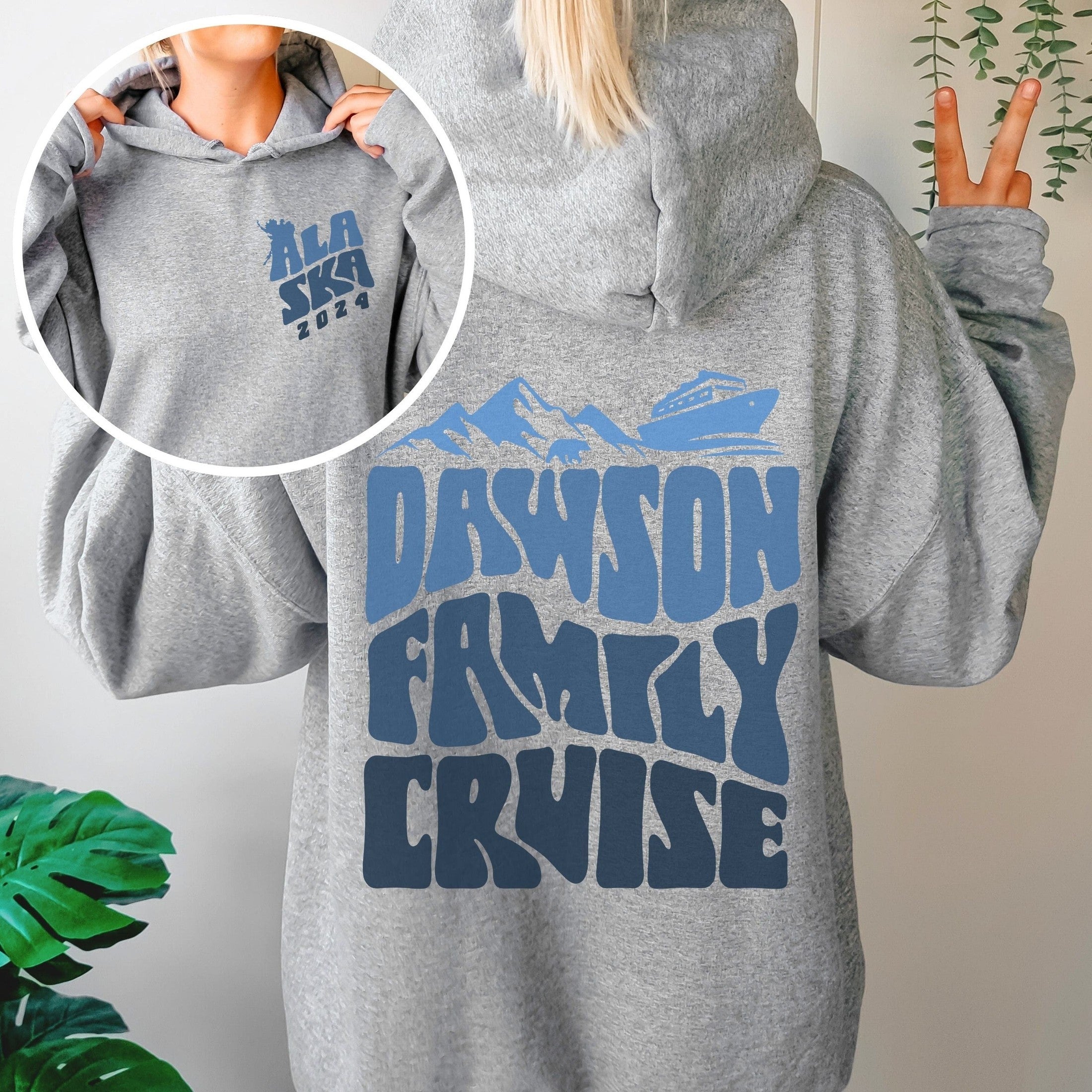 Woman wearing custom matching family Alaska cruise shirt for group Alaskan vacation. Shown in gray hoodie sweatshirt