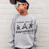 boy wearing custom matching family winter vacation shirts with funny Chillin With My Snowmies gnome design perfect for group ski trip weekends shown on gray crewneck sweatshirt