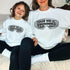 mother and daughter wearing custom matching family winter vacation shirts with funny Chillin With My Snowmies goggles design perfect for group ski trip weekends shown on white crewneck sweatshirts