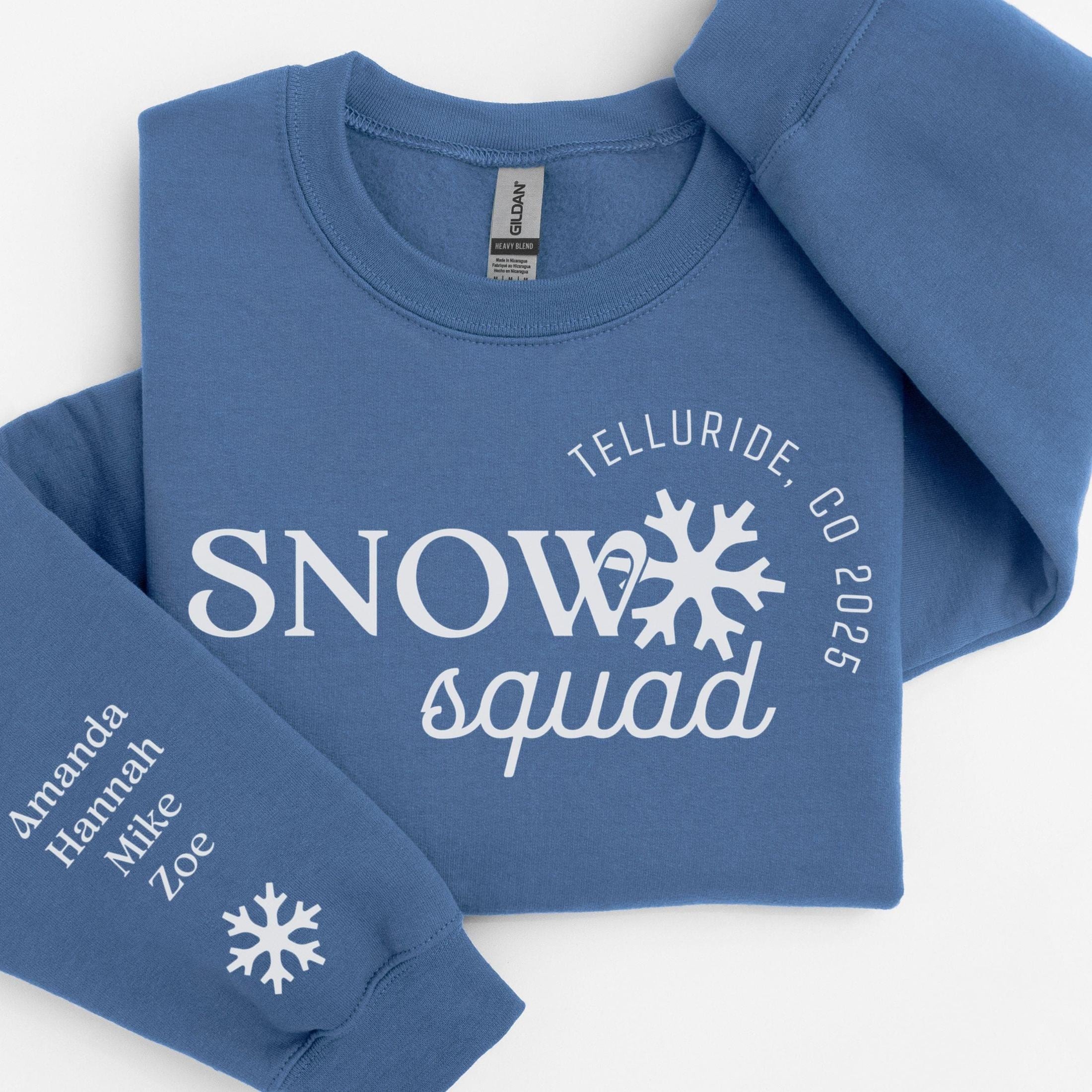 Custom matching family snow Squad sweatshirt for group ski weekend mountain vacation with sleeve print for names shown in indigo blue