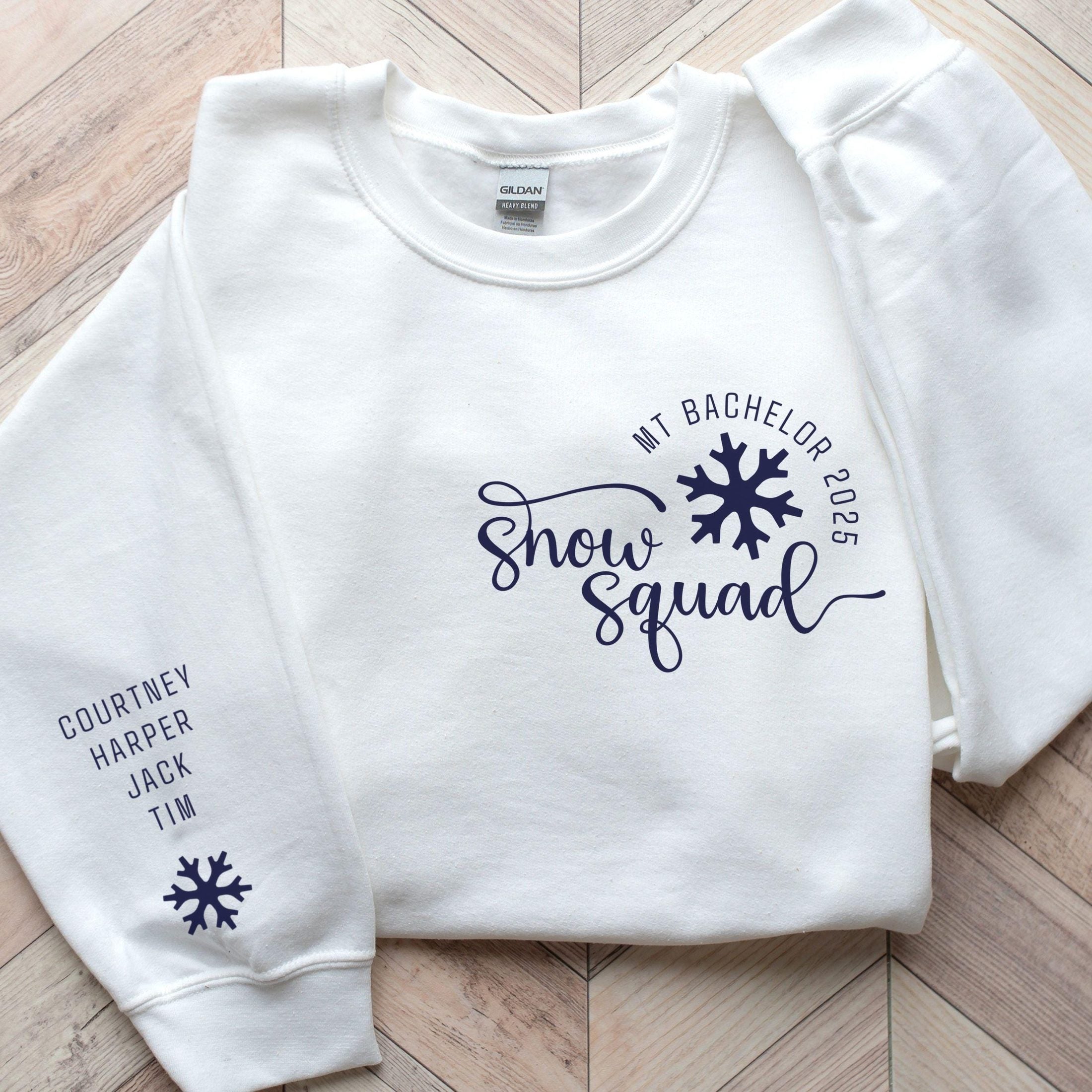 Custom matching family snow Squad sweatshirt for group ski weekend mountain vacation with sleeve print for names shown in white