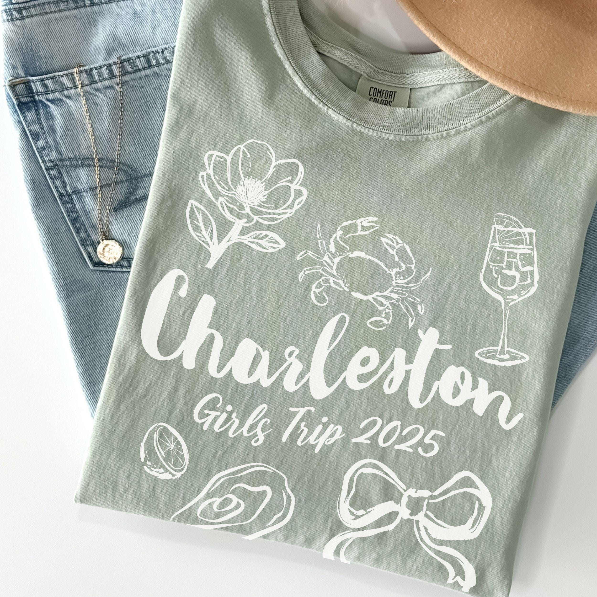 Charleston girls trip shirt with coquette bow and travel doodle design, printed on Comfort Colors Bay for matching group vacations