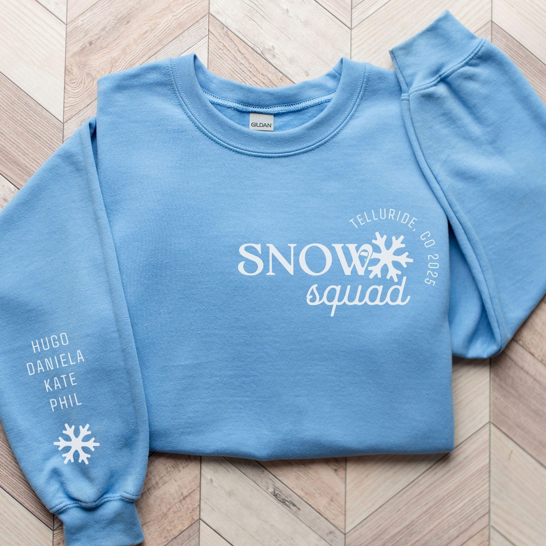 Custom matching family snow Squad sweatshirt for group ski weekend mountain vacation with sleeve print for names shown in carolina blue