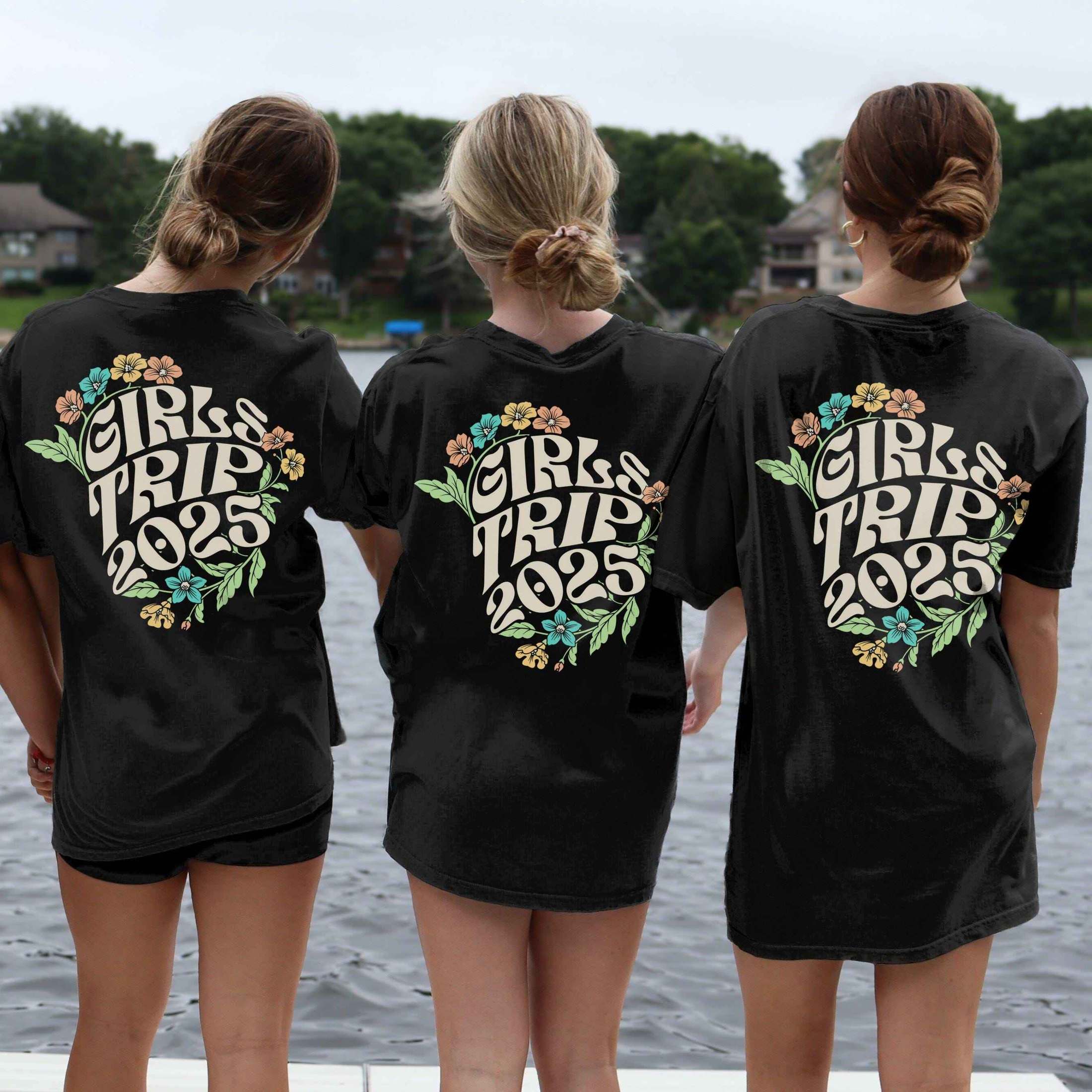 Women wearing custom matching 60s or 70s retro floral girls trip shirts for group vacation shown in Comfort Colorsblack