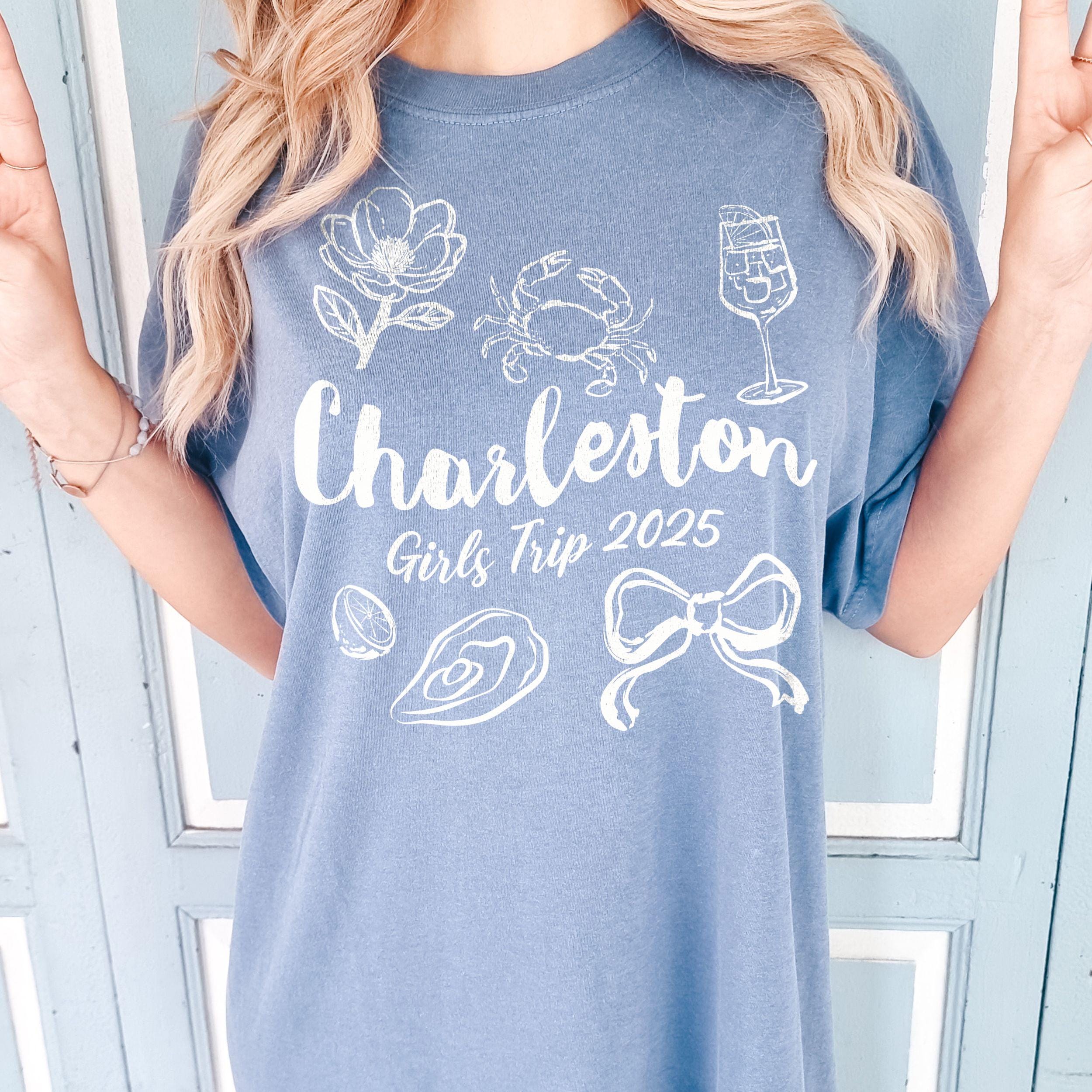 Charleston girls trip shirt with coquette bow and travel doodle design, printed on Comfort Colors Washed Denim for matching group vacations