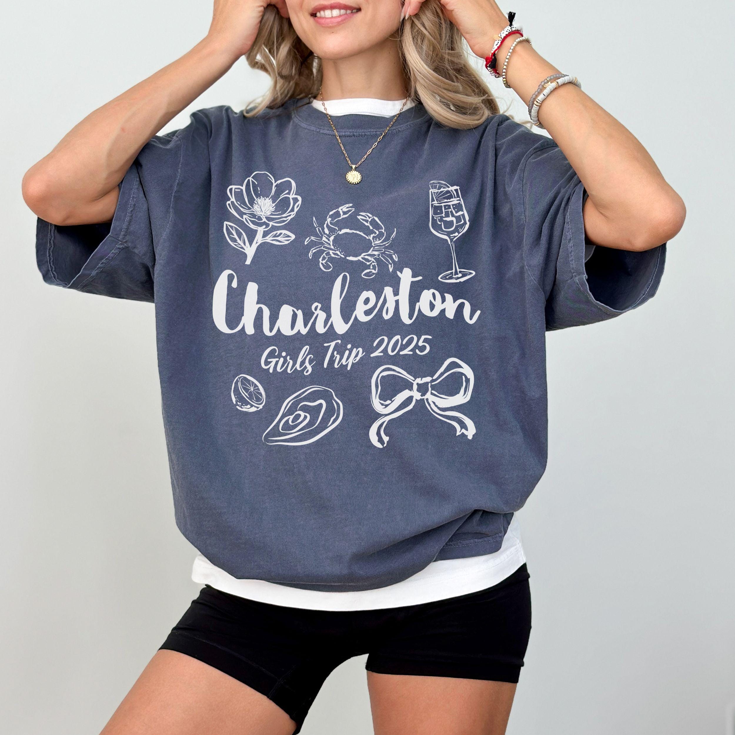 Charleston girls trip shirt with coquette bow and travel doodle design, printed on Comfort Colors Denim for matching group vacations