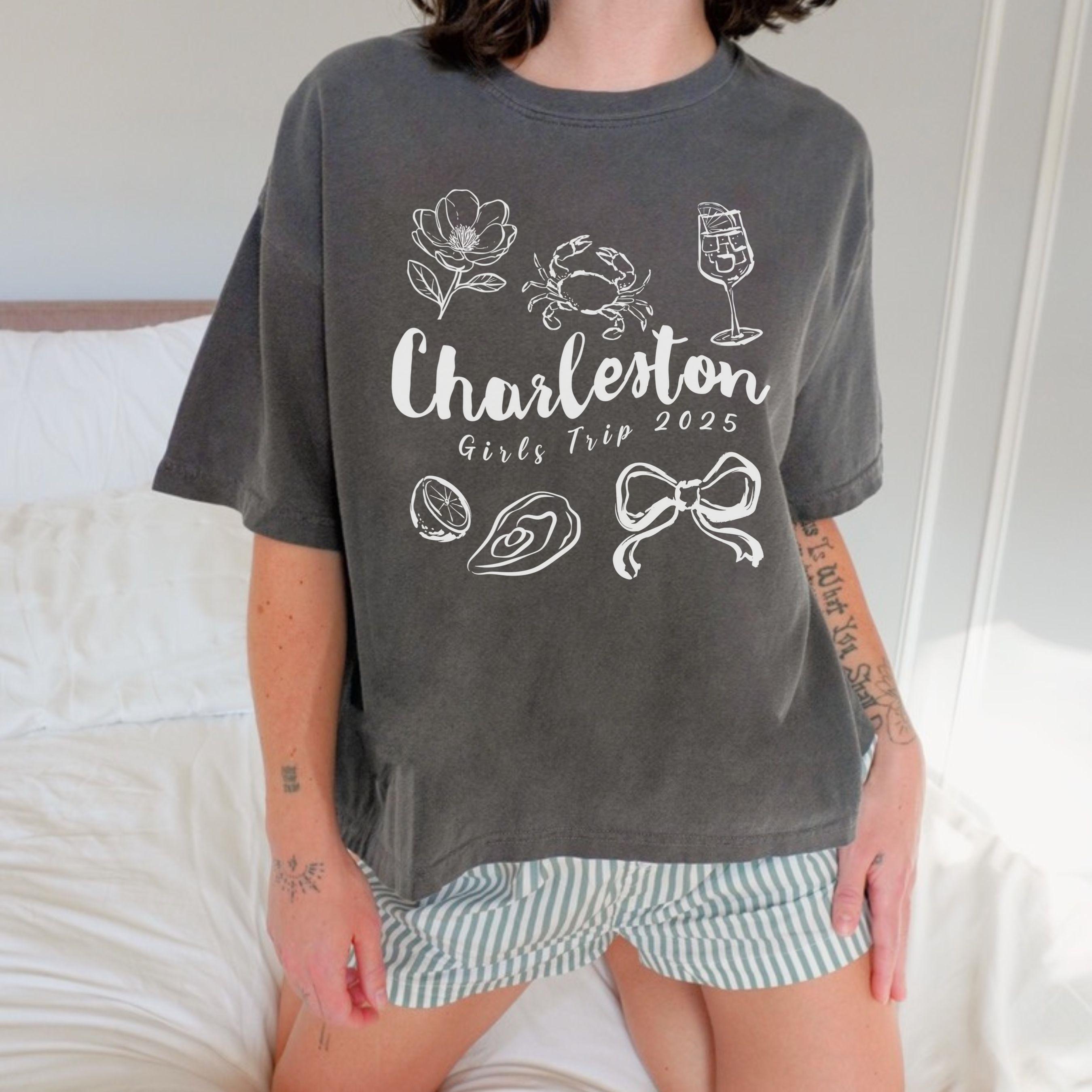 Charleston girls trip shirt with coquette bow and travel doodle design, printed on Comfort Colors Pepper boxy crop tee for matching group vacations
