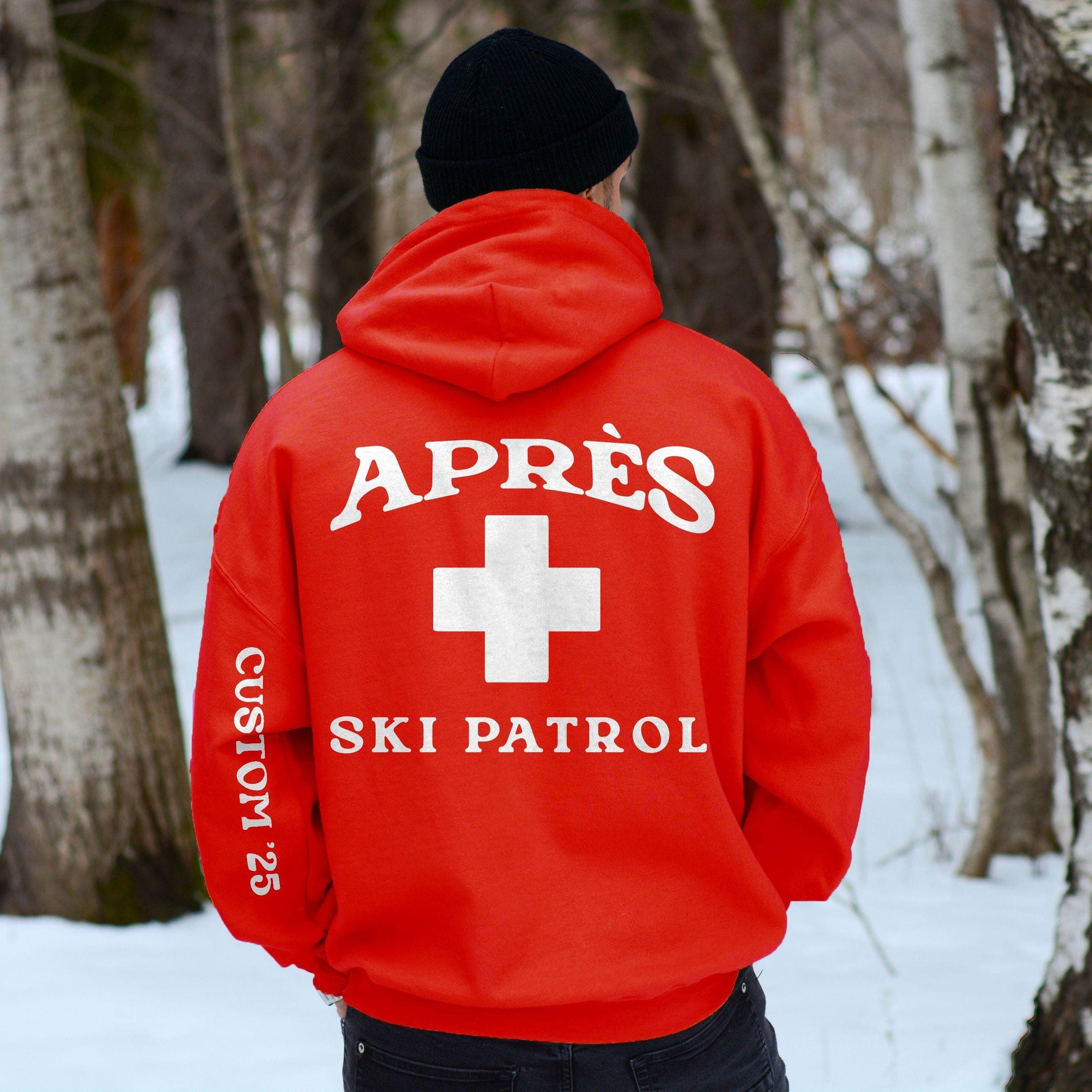 Woman wearing Custom Matching Group Apres Ski Patrol Red Cross ski trip oversized Hoodie