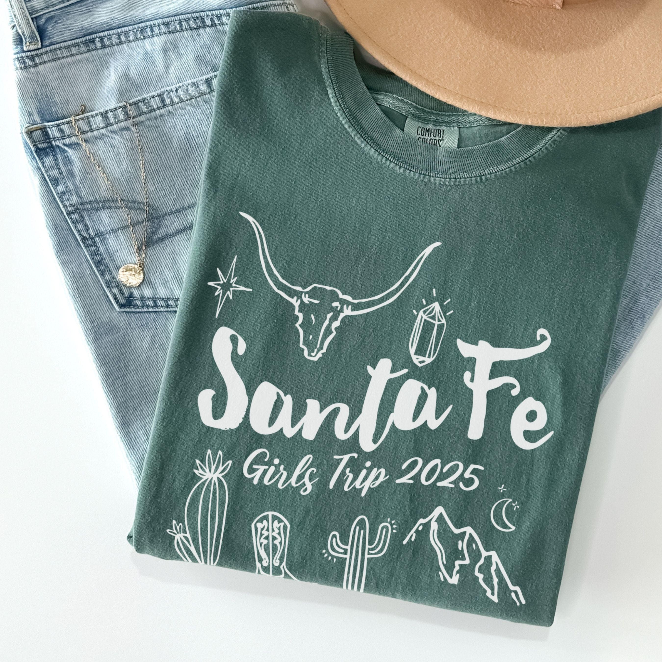 Matching Santa Fe desert girls weekend trip shirt with Western doodle design, featuring cactus and skull on Comfort Colors Blue Spruce