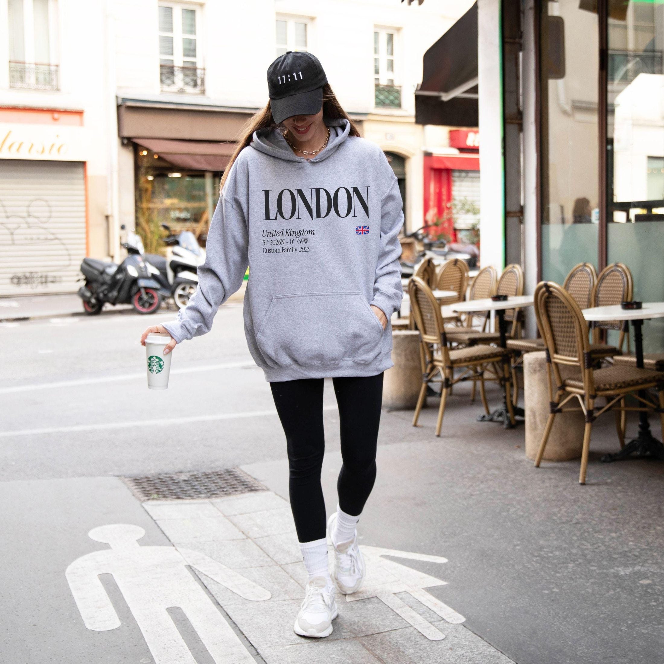 woman wearing custom matching family London shirts for UK England vacation. Shown in gray hoodie