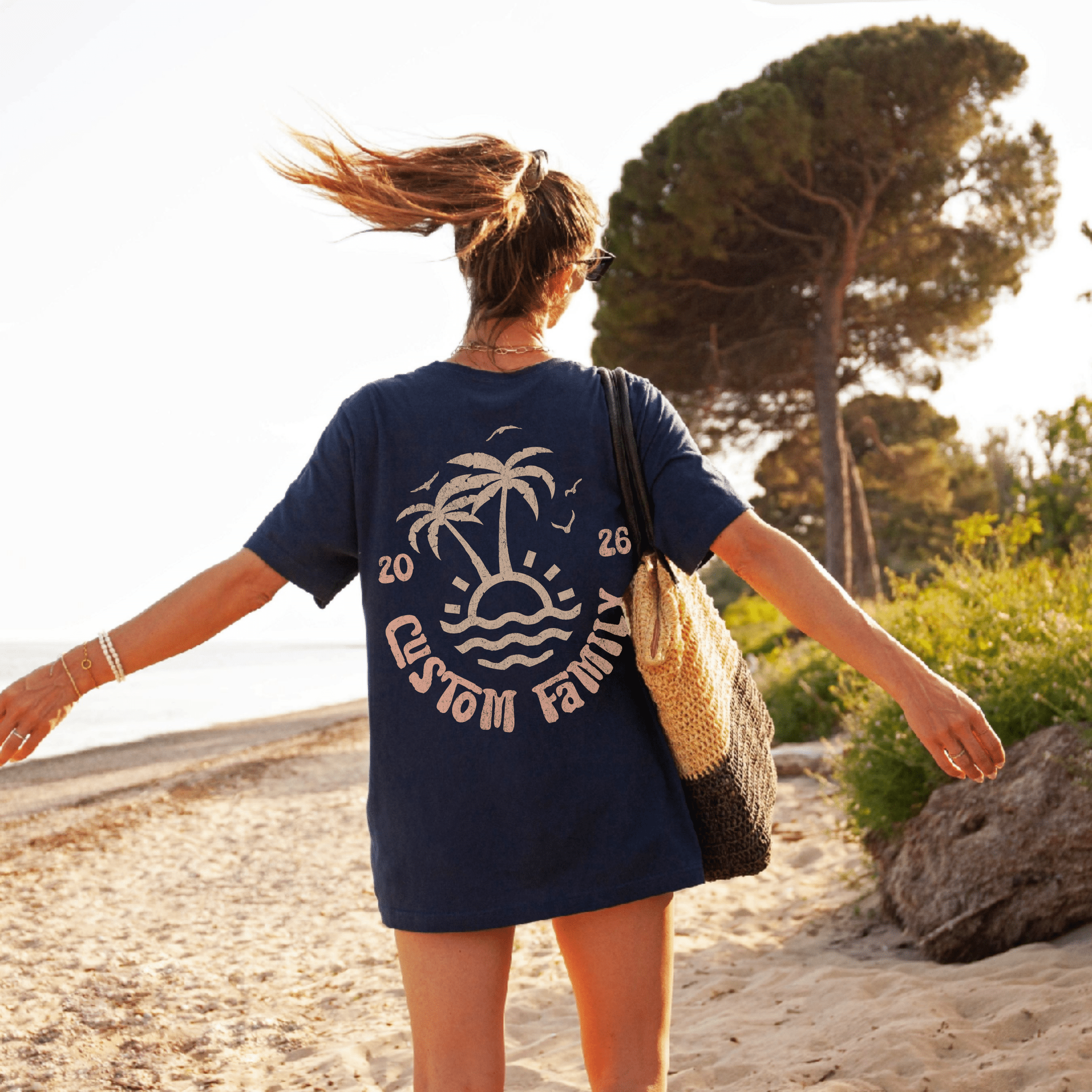 Woman wearing custom matching family beach vacation shirt with peach retro palm tree design in comfort colors navy