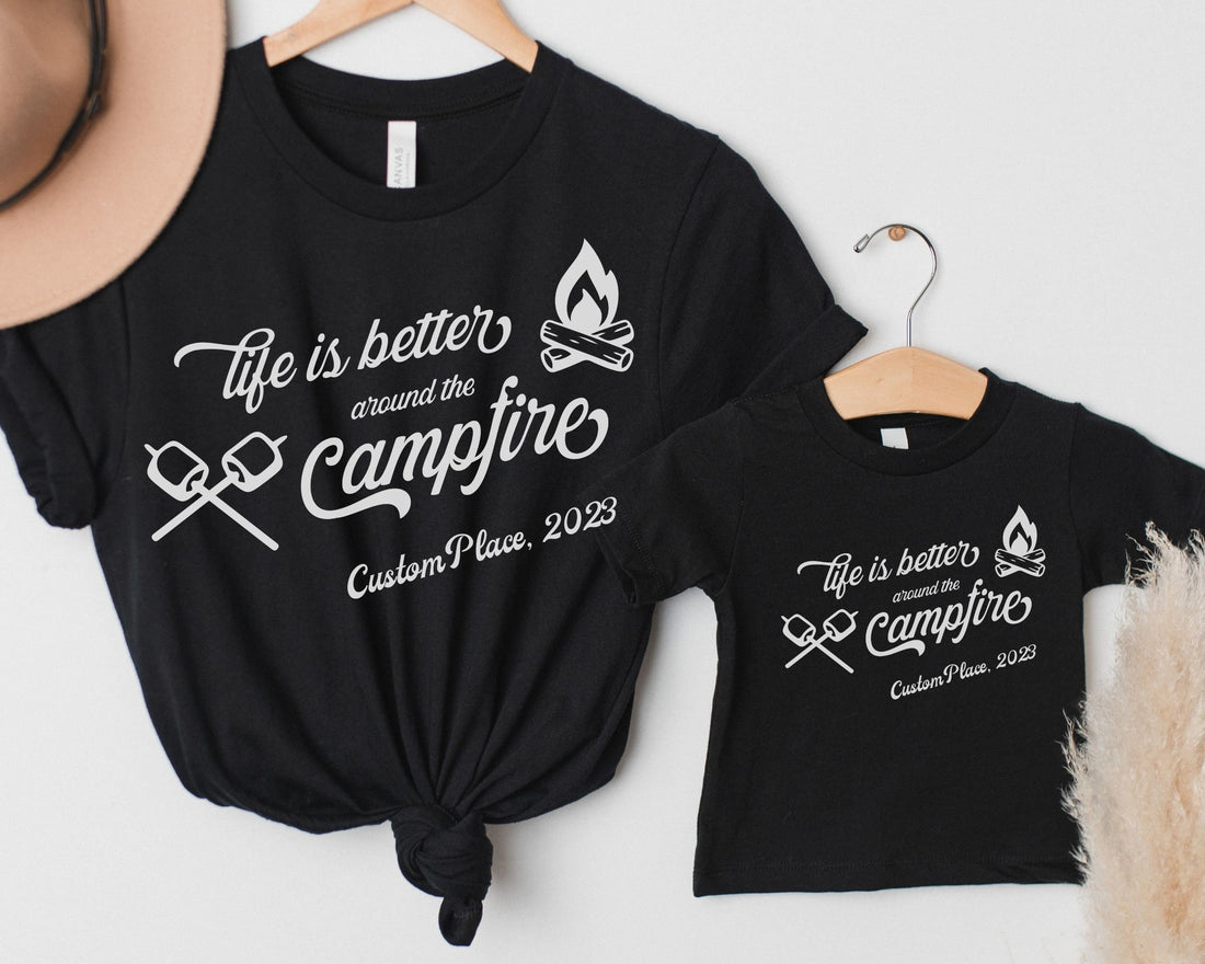 Adult and kid sized Custom matching family camping shirts with life is better around the campfire design on black shirts