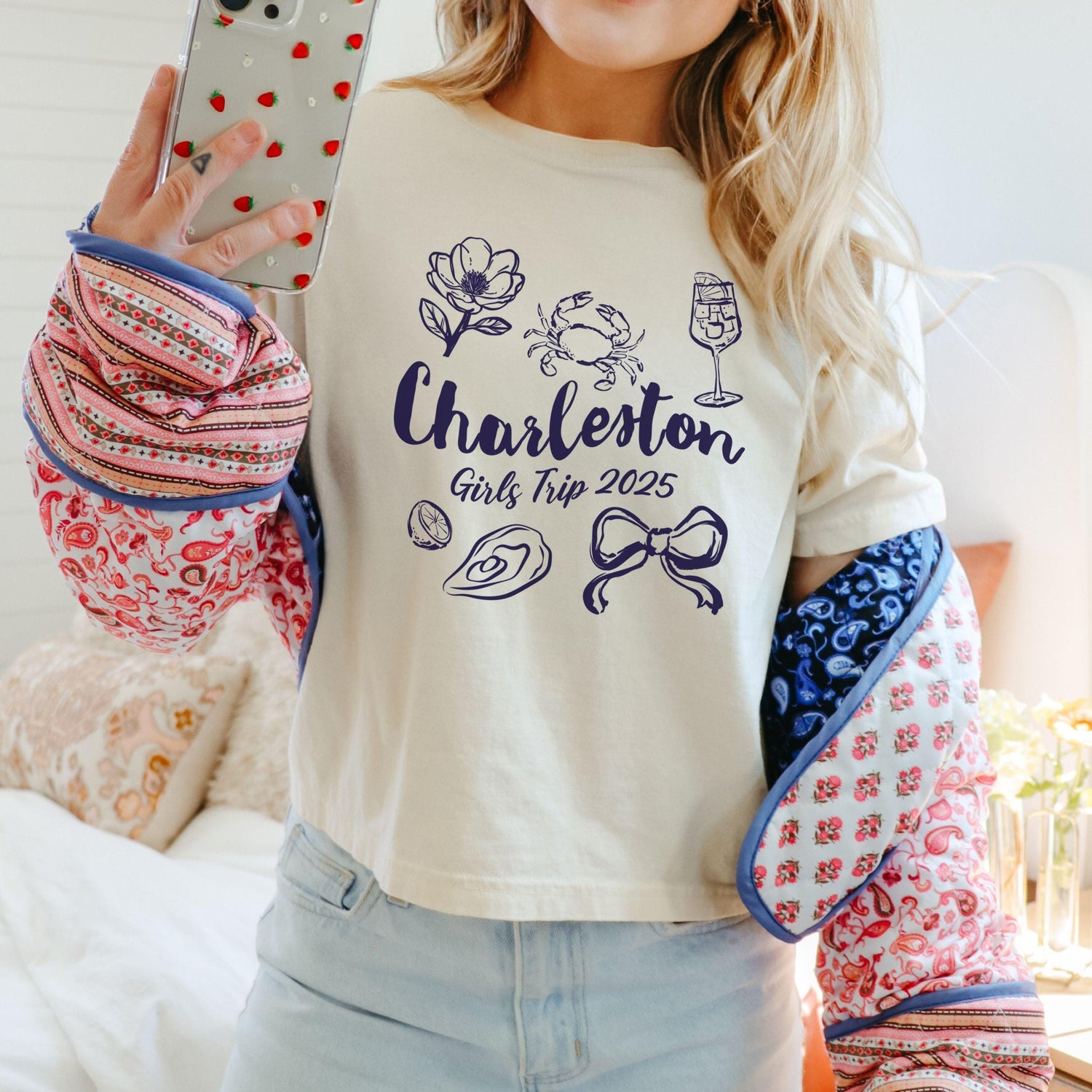 Charleston girls trip shirt with coquette bow and travel doodle design, printed on Comfort Colors Ivory boxy crop tee for matching group vacations