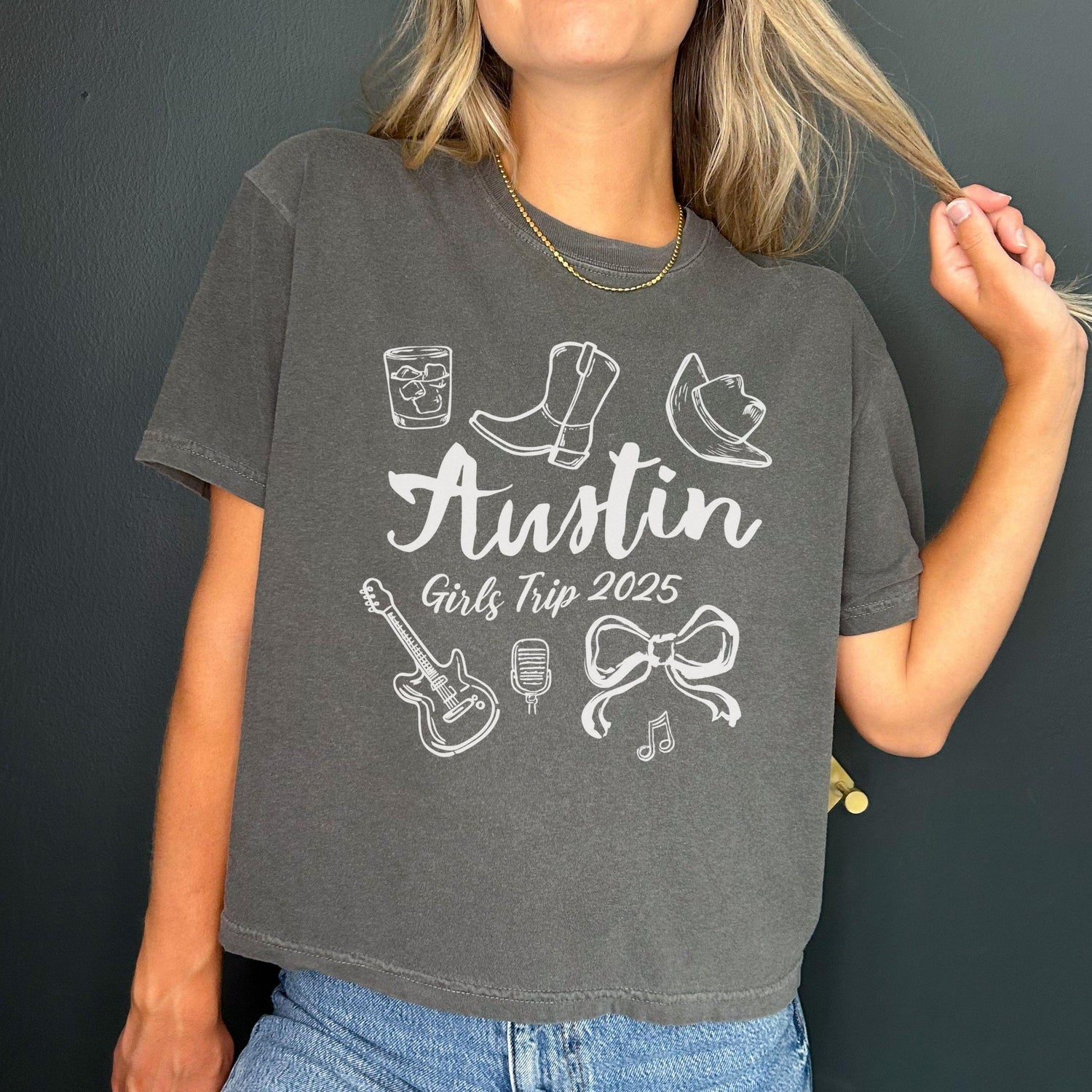 Austin girls trip shirt with coquette bow and travel doodle design, printed on Comfort Colors Pepper boxy crop tee for matching group vacations