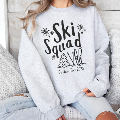 Custom Ski Squad sweatshirt with winter snow doodle design, perfect for matching family or group ski trip. Shown in Ash