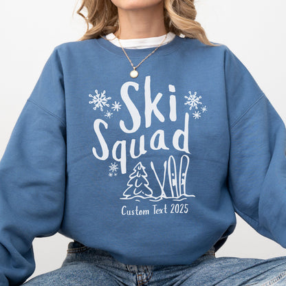 Custom Ski Squad sweatshirt with winter snow doodle design, perfect for matching family or group ski trip. Shown in Indigo