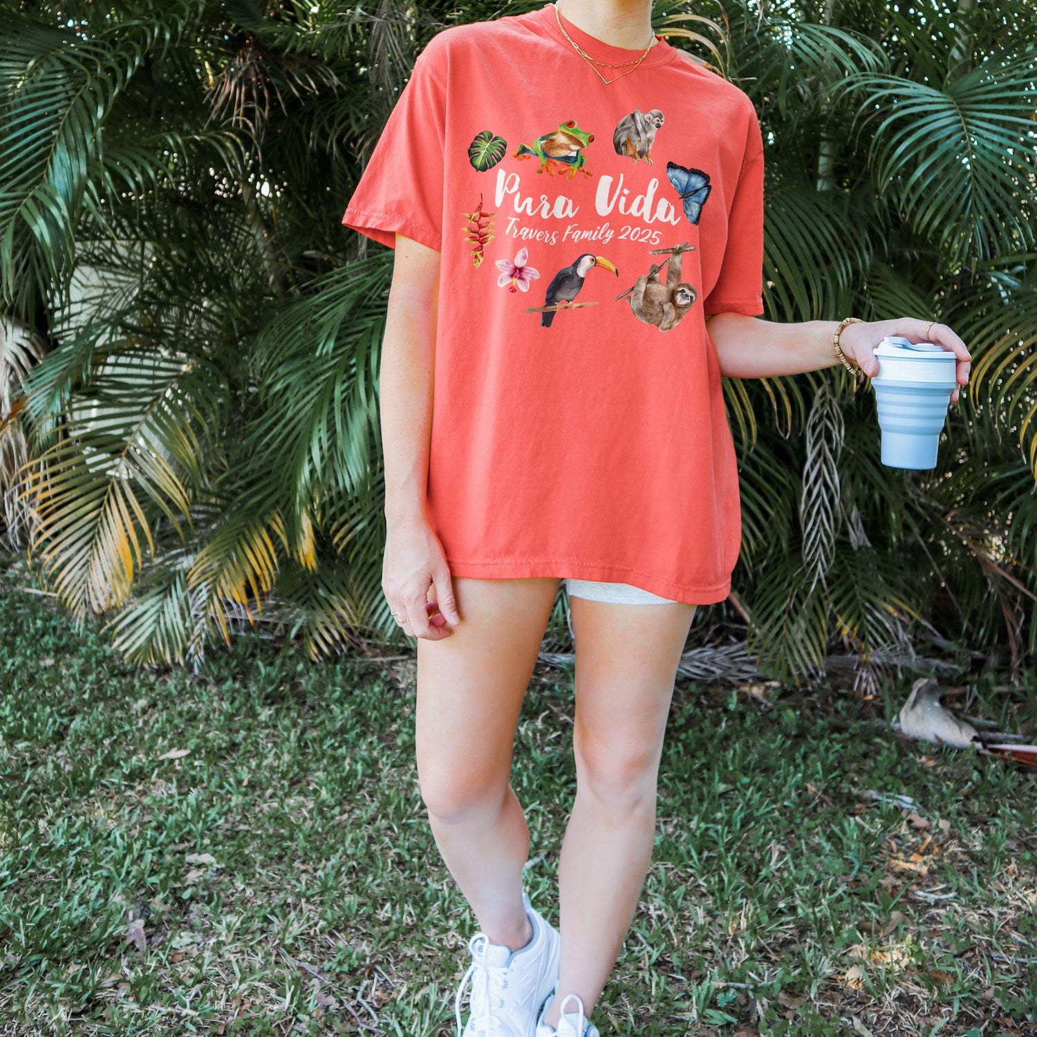 Costa Rica Pura Vida sloth and toucan design on Comfort Colors Bright Salmon matching family vacation shirt.