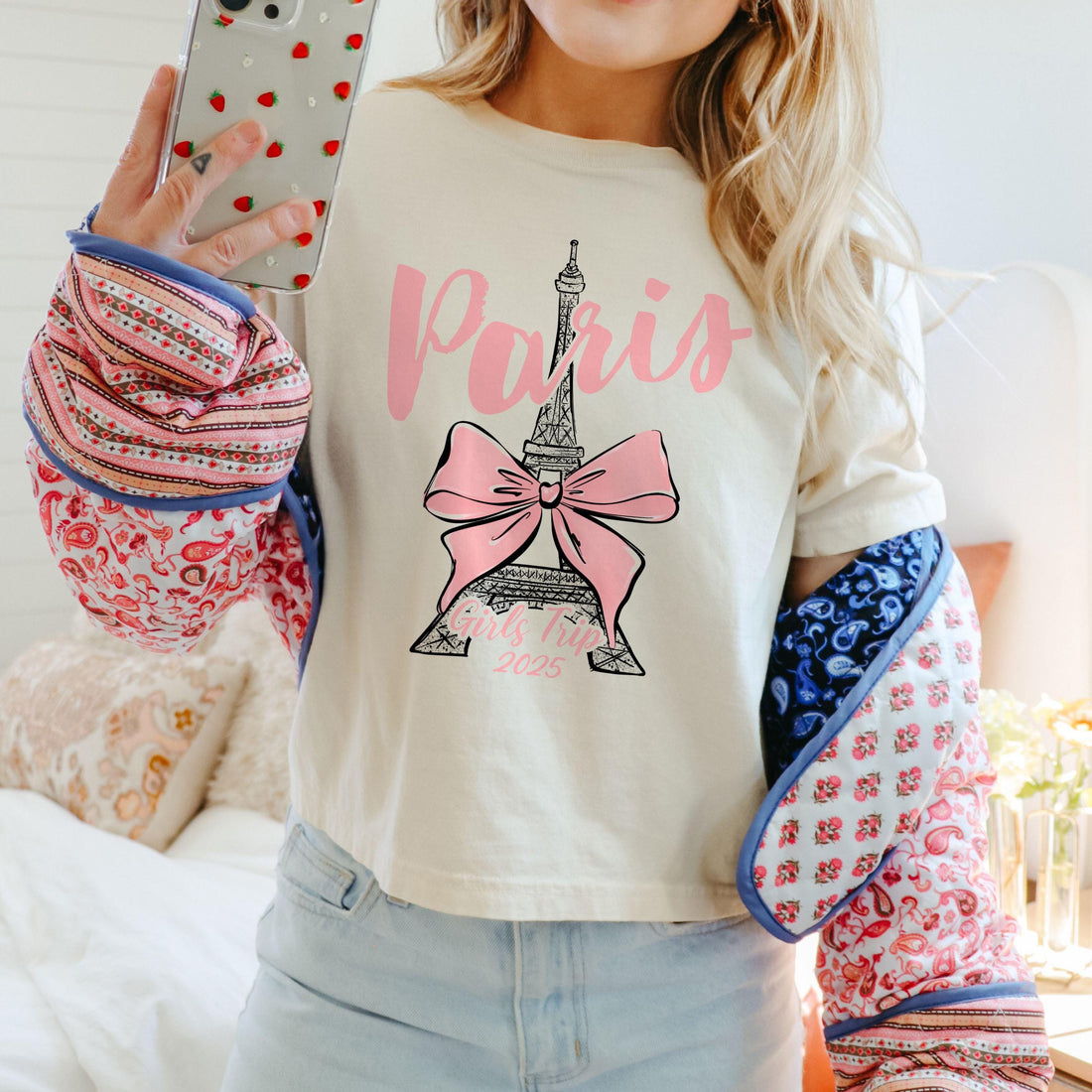 Custom Paris 2025 coquette-style t-shirt with Eiffel Tower and bow graphic, great for matching girls trip outfits